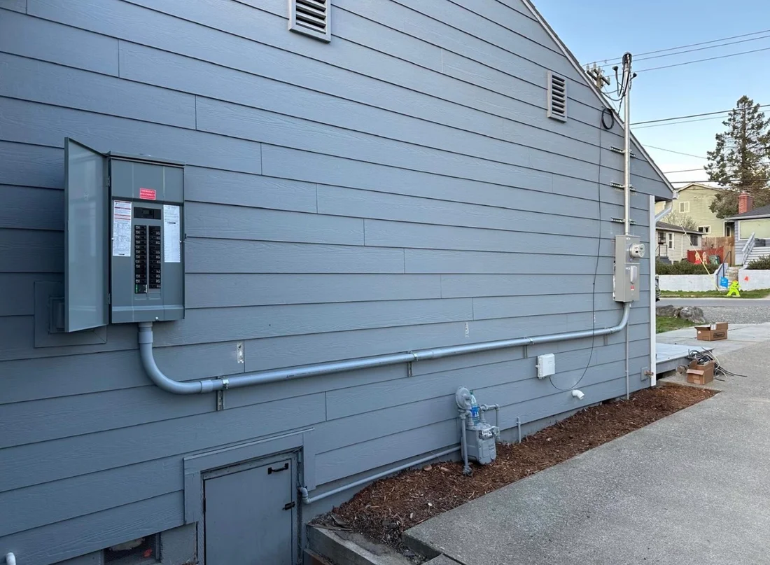 Exterior breaker panel with conduit running to the meter